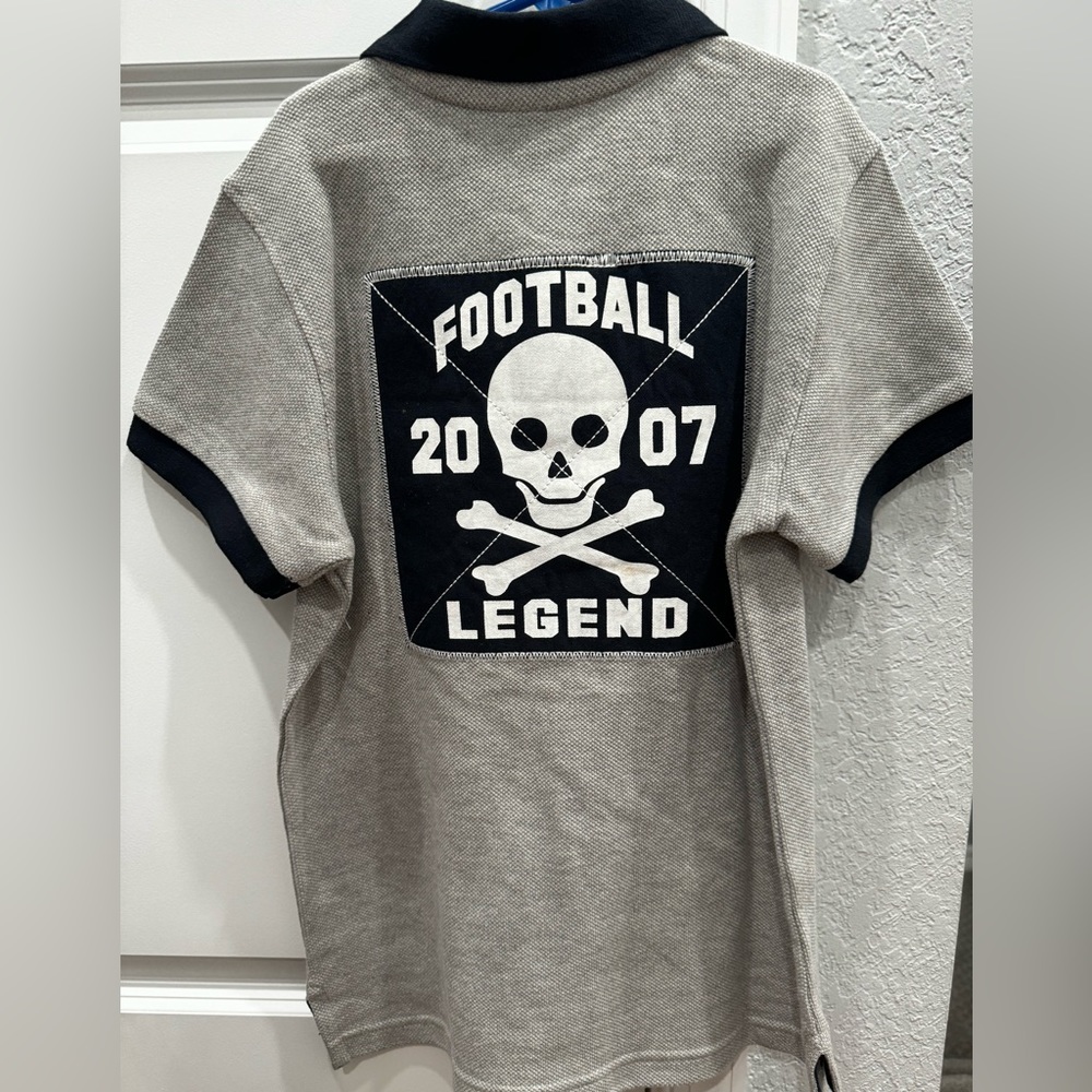 New with tags Crazy 8 collared T-shirt with football patch on back. Size m 7/8
